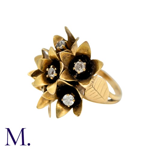 43 - A Diamond Ring in yellow gold, designed as a bouquet of flowers, each flower set to the centre with ... 
