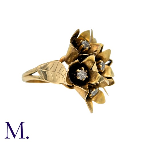 43 - A Diamond Ring in yellow gold, designed as a bouquet of flowers, each flower set to the centre with ... 