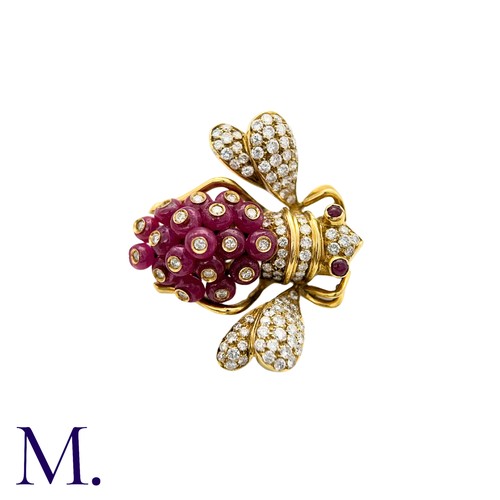 402 - GIOVANE, A Ruby and Diamond Bee Brooch in 18k yellow gold, set with approximately 7.30cts of ruby be... 