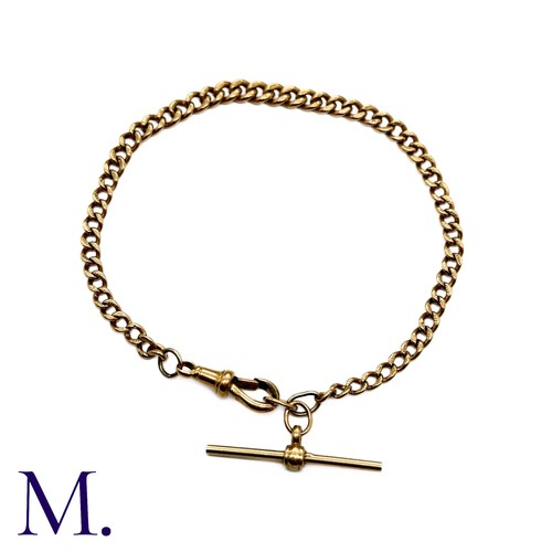 20 - An Antique Curb Bracelet in 9K rose gold with swivel clip and T-bar.  Links marked '375' indicating ... 