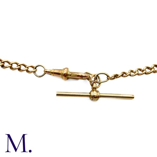 20 - An Antique Curb Bracelet in 9K rose gold with swivel clip and T-bar.  Links marked '375' indicating ... 