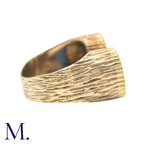49 - A Diamond Ring in yellow gold, the textured form with two oval plaques set with round cut diamonds. ... 