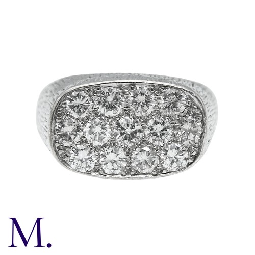 237 - A Diamond Ring in 18k white gold, the textured form set to the oval face with round brilliant cut di... 