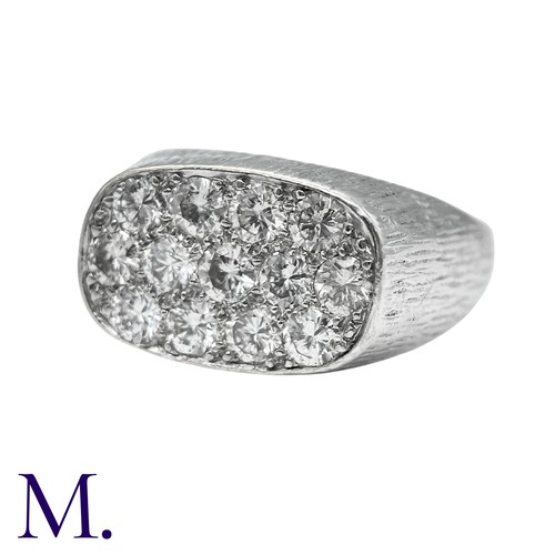 237 - A Diamond Ring in 18k white gold, the textured form set to the oval face with round brilliant cut di... 