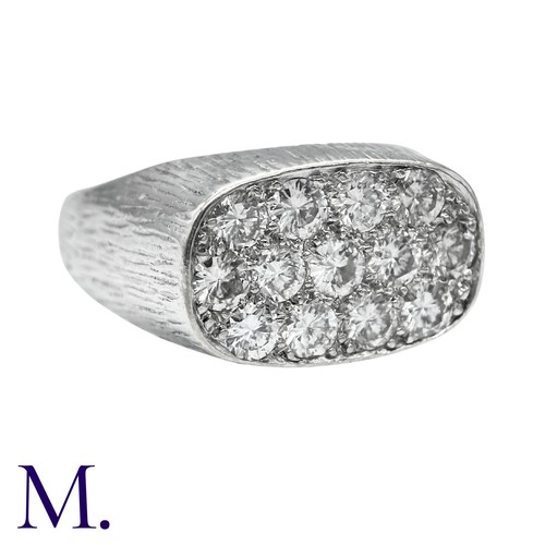 237 - A Diamond Ring in 18k white gold, the textured form set to the oval face with round brilliant cut di... 