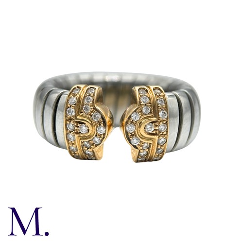 60 - BULGARI , A DIAMOND PARENTESI RING in 18k yellow gold and steel, the terminals set with round brilli... 
