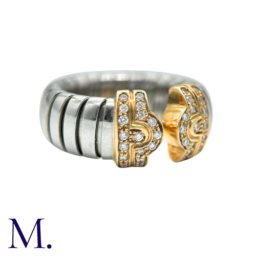 60 - BULGARI , A DIAMOND PARENTESI RING in 18k yellow gold and steel, the terminals set with round brilli... 