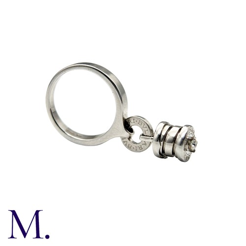 239 - BVLGARI, A Diamond B.zero1 Ring in 18k white gold, set with a dangling B.Zero1 Element, set with a r... 