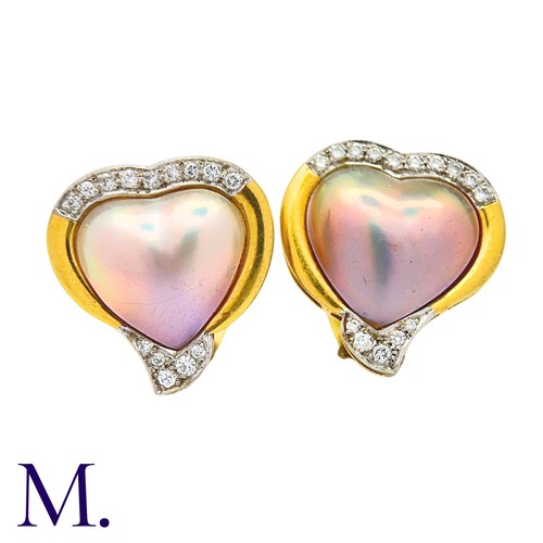 46 - A Pair Of mother of Pearl And Diamond Heart Earrings in 18k yellow gold, comprising heart shape moth... 