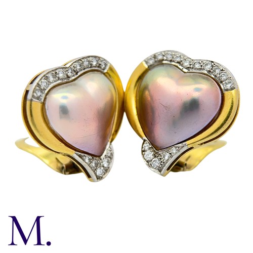 46 - A Pair Of mother of Pearl And Diamond Heart Earrings in 18k yellow gold, comprising heart shape moth... 