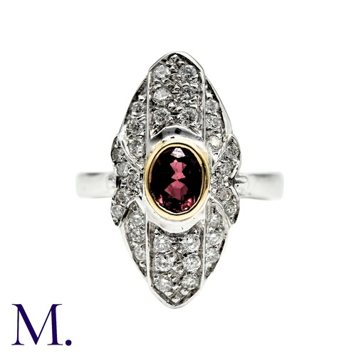 240 - A Ruby And Diamond Dress Ring in 18k white gold, the navette form set with an oval cut ruby and acce... 