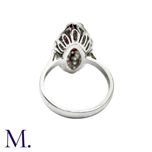 240 - A Ruby And Diamond Dress Ring in 18k white gold, the navette form set with an oval cut ruby and acce... 