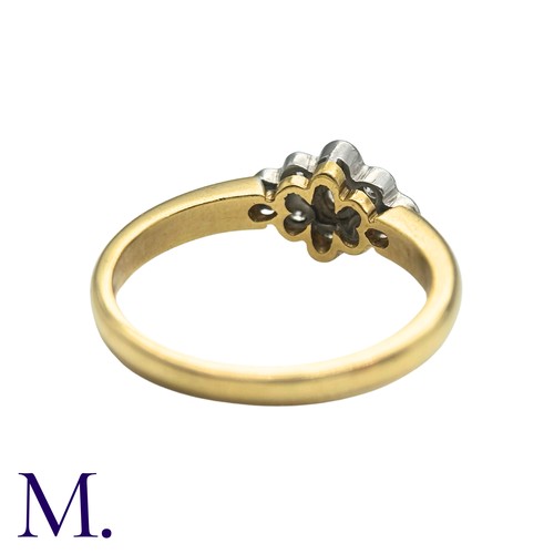 50 - A Diamond Cluster Ring inn 18 yellow gold, set with a cluster of nine round cut diamonds. Stamped 75... 