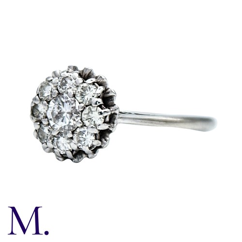 28 - A Diamond Cluster Ring in 18K white gold, set with nine diamonds totalling approximately 0.55ct in w... 