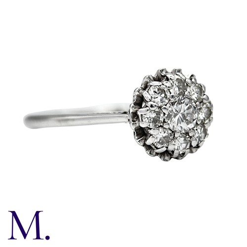 28 - A Diamond Cluster Ring in 18K white gold, set with nine diamonds totalling approximately 0.55ct in w... 