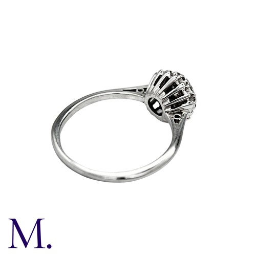28 - A Diamond Cluster Ring in 18K white gold, set with nine diamonds totalling approximately 0.55ct in w... 