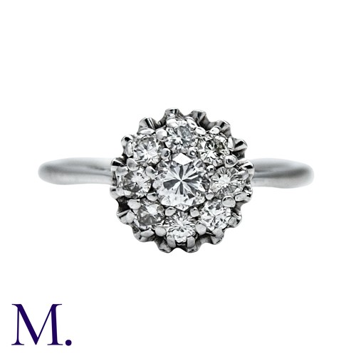 28 - A Diamond Cluster Ring in 18K white gold, set with nine diamonds totalling approximately 0.55ct in w... 