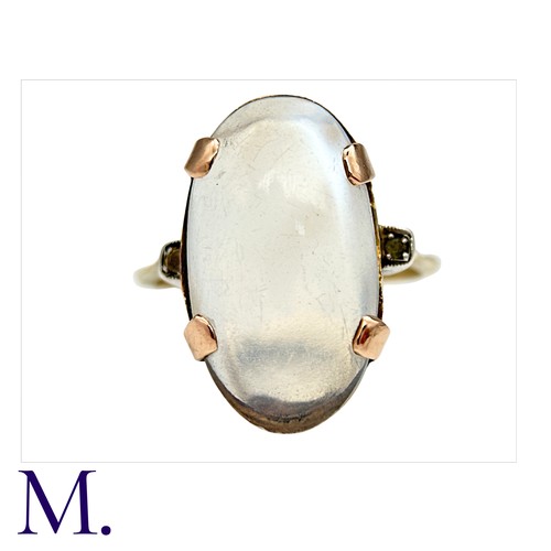 9 - A Moonstone Ring in 9K rose gold, the oval cabochon moonstone approximately 2.0x1.2cm secured with f... 