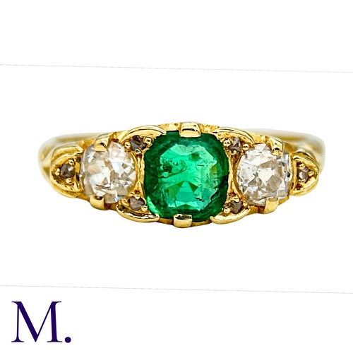 33 - An Antique Emerald and Diamond Ring in 18K yellow gold.  Set with a bright cushion cut emerald (of a... 