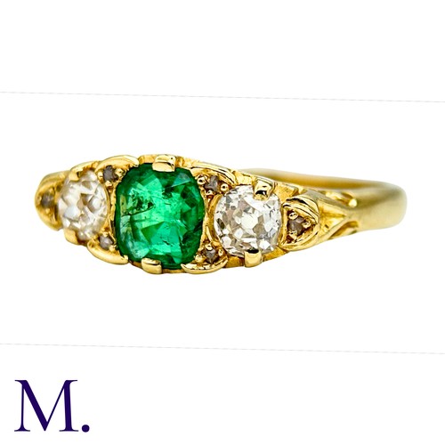33 - An Antique Emerald and Diamond Ring in 18K yellow gold.  Set with a bright cushion cut emerald (of a... 