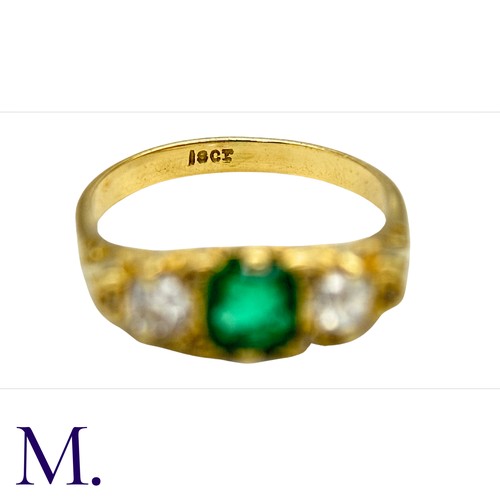 33 - An Antique Emerald and Diamond Ring in 18K yellow gold.  Set with a bright cushion cut emerald (of a... 