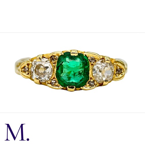 33 - An Antique Emerald and Diamond Ring in 18K yellow gold.  Set with a bright cushion cut emerald (of a... 