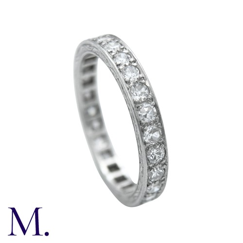 44 - A Diamond Eternity Ring with carved sides set with round cut diamonds weighing approximately 0.80ct.... 
