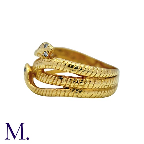 191 - A Diamond Snake Ring in 18k yellow gold, designed as coiled snakes, set to the eyes with round cut d... 