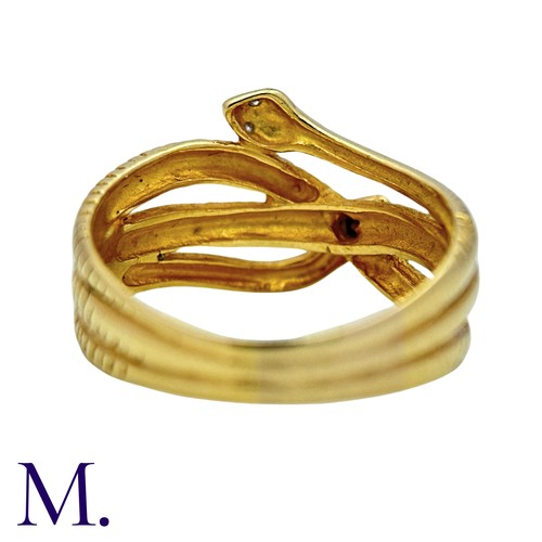 191 - A Diamond Snake Ring in 18k yellow gold, designed as coiled snakes, set to the eyes with round cut d... 