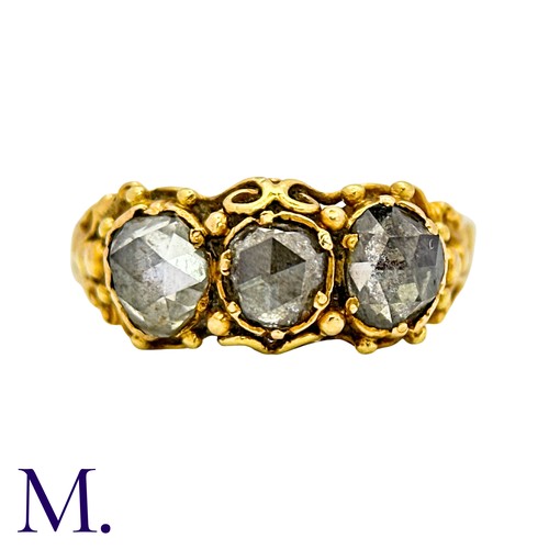 53 - An Antique Rose Cut Diamond Three Stone Ring in yellow gold, set with three rose cut diamonds to an ... 
