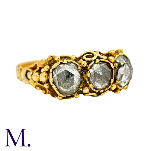 53 - An Antique Rose Cut Diamond Three Stone Ring in yellow gold, set with three rose cut diamonds to an ... 