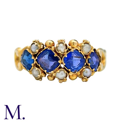 55 - A Sapphire And Pearl Ring in yellow gold, set with four square cushion shaped sapphires punctuated b... 