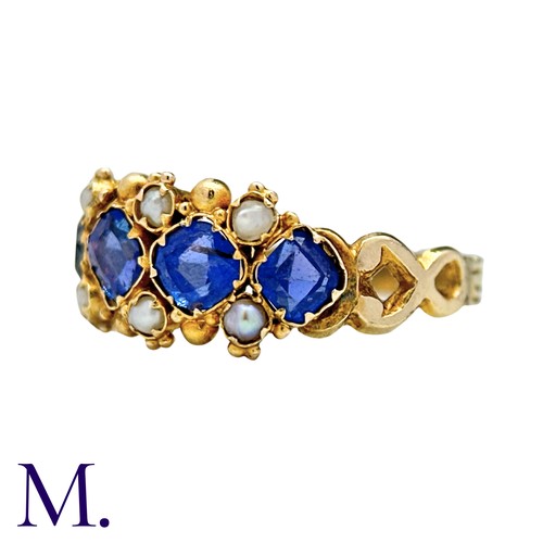 55 - A Sapphire And Pearl Ring in yellow gold, set with four square cushion shaped sapphires punctuated b... 