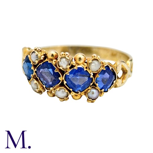 55 - A Sapphire And Pearl Ring in yellow gold, set with four square cushion shaped sapphires punctuated b... 