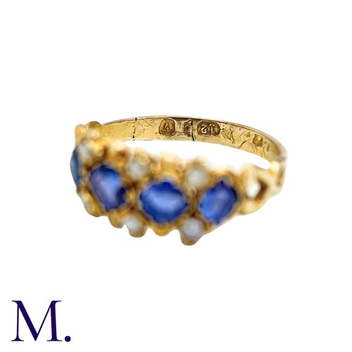 55 - A Sapphire And Pearl Ring in yellow gold, set with four square cushion shaped sapphires punctuated b... 