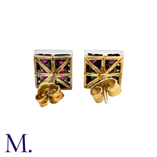 51 - A Pair Of Ruby And Diamond Earrings in 18k yellow gold and platinum each set with three rows of roun... 