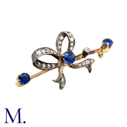 236 - An Antique Sapphire And Diamond Bow Brooch in yellow gold and silver, comprising a diamond set bow o... 