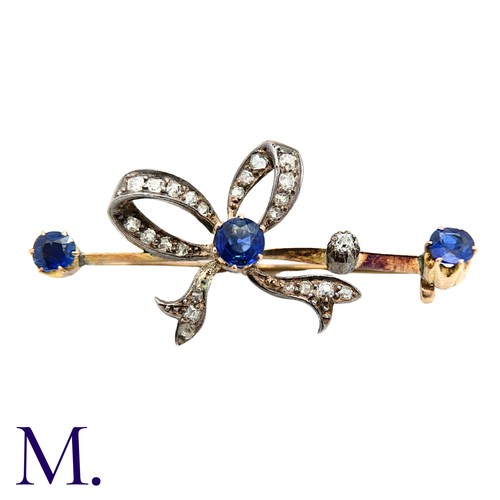 236 - An Antique Sapphire And Diamond Bow Brooch in yellow gold and silver, comprising a diamond set bow o... 