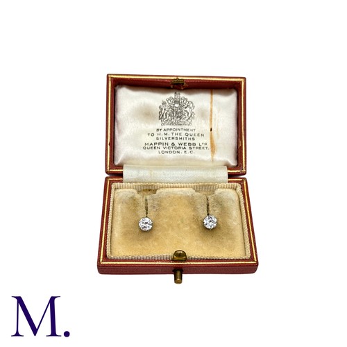 56 - A Pair Of Diamond Stud Earrings in platinum and white gold, each comprising a round cut diamond of a... 