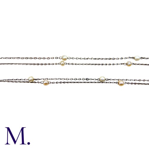 41 - A Platinum & Pearl Chain, comprising a fine platinum belcher link chain punctuated with pearls. Unma... 