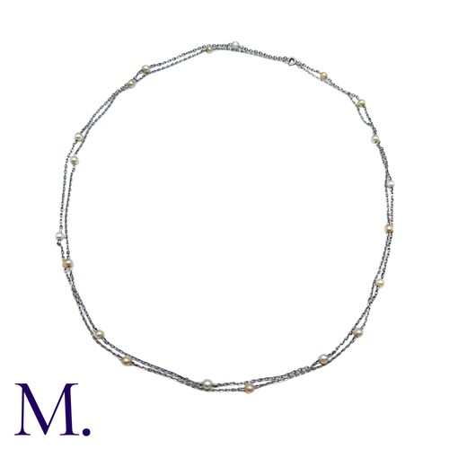 41 - A Platinum & Pearl Chain, comprising a fine platinum belcher link chain punctuated with pearls. Unma... 