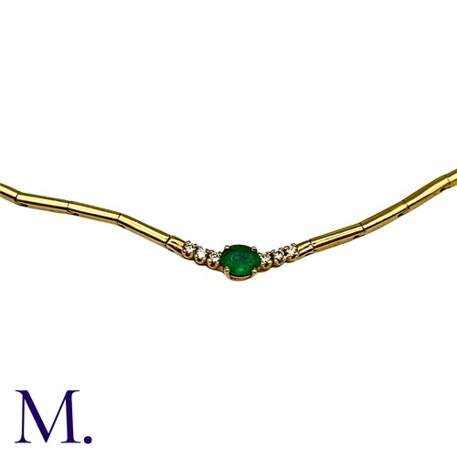 45 - An Emerald And Diamond Necklace in yellow gold, set with a principal oval cut emerald accented eithe... 