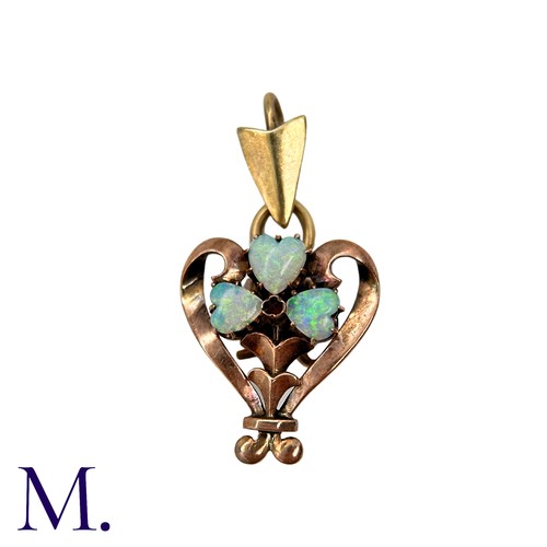 207 - An Opal And Ruby Pendant in 8k yellow gold set with three heart shape cabochon opals and a cabochon ... 