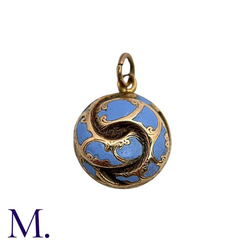 26 - An Antique Enamel Hairwork Pendant in yellow gold, the knotted circular form decorated with light bl... 
