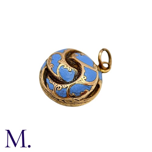 26 - An Antique Enamel Hairwork Pendant in yellow gold, the knotted circular form decorated with light bl... 