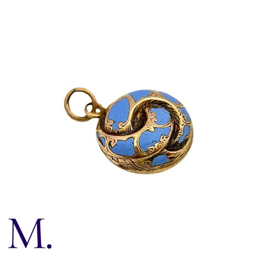 26 - An Antique Enamel Hairwork Pendant in yellow gold, the knotted circular form decorated with light bl... 