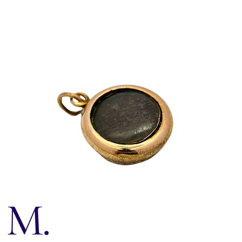26 - An Antique Enamel Hairwork Pendant in yellow gold, the knotted circular form decorated with light bl... 