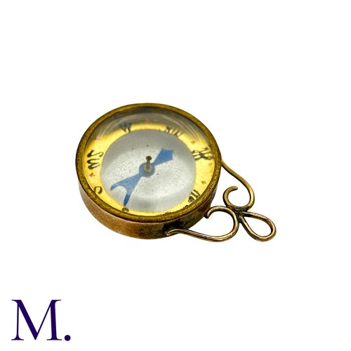 4 - An Antique Compass Pendant in 9k yellow gold, the central compass below a scrolling top. Hallmarked ... 
