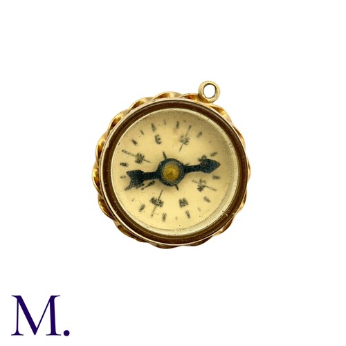 23 - An Antique Compass Pendant in 9k yellow gold, the central compass within a twisted border. Hallmarke... 