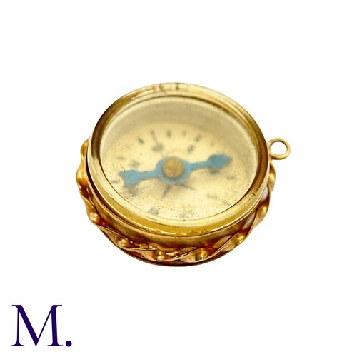23 - An Antique Compass Pendant in 9k yellow gold, the central compass within a twisted border. Hallmarke... 